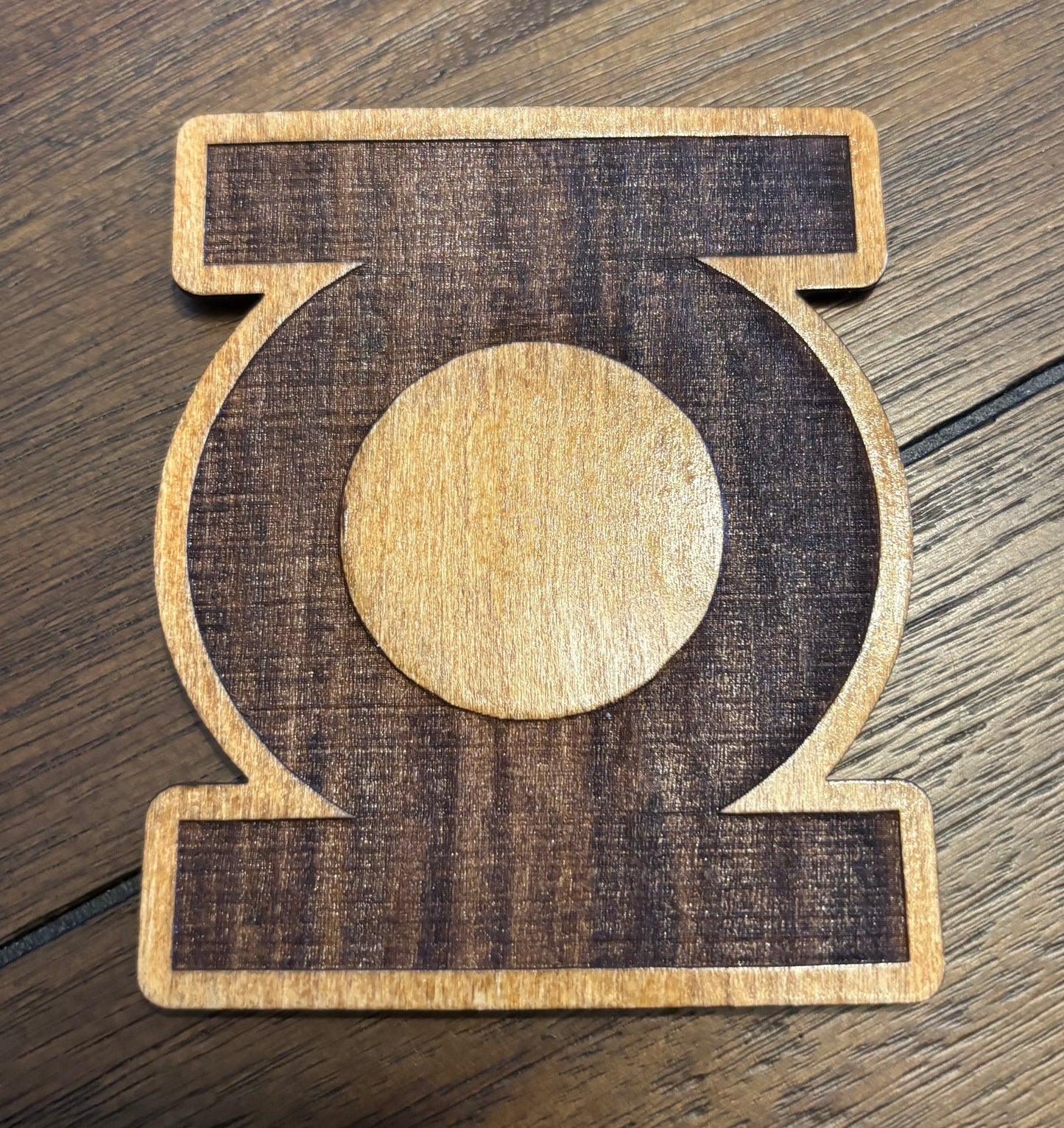 Stained basswood fridge magnet of the Green Lantern logo