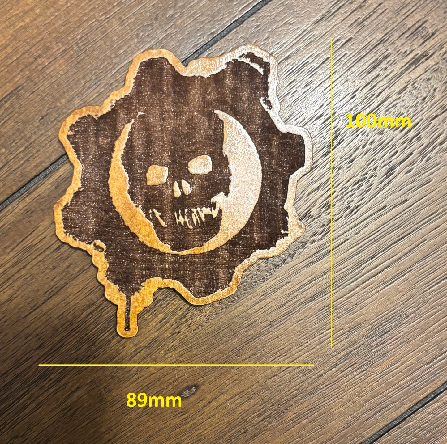 Stained basswood fridge magnet of the Gears of War logo