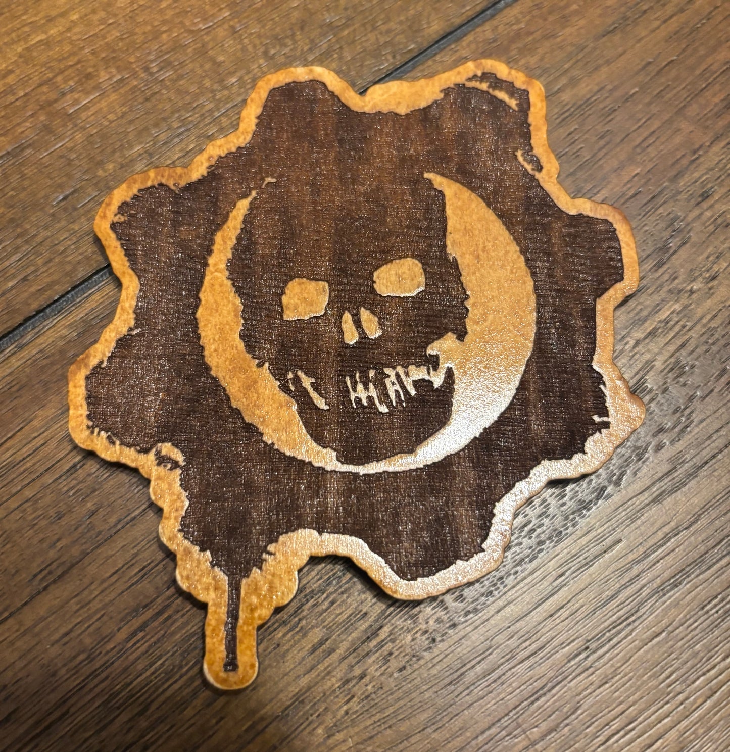 Stained basswood fridge magnet of the Gears of War logo