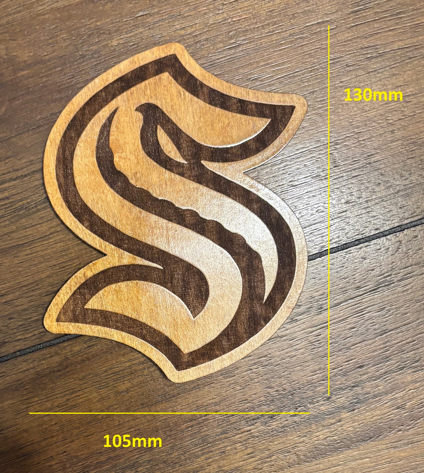 Stained basswood fridge magnet of the Seattle Kraken hockey team logo