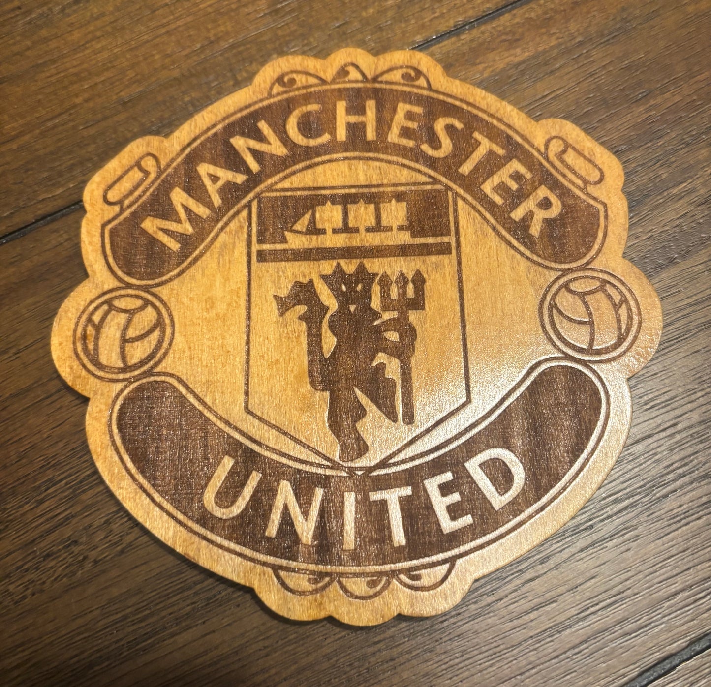Stained basswood fridge magnet of the Manchester United soccer team logo