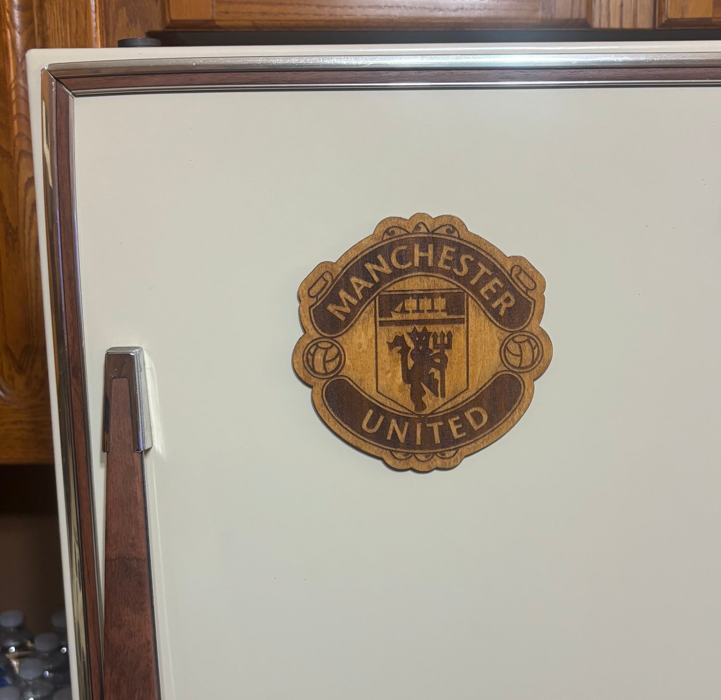 Stained basswood fridge magnet of the Manchester United soccer team logo