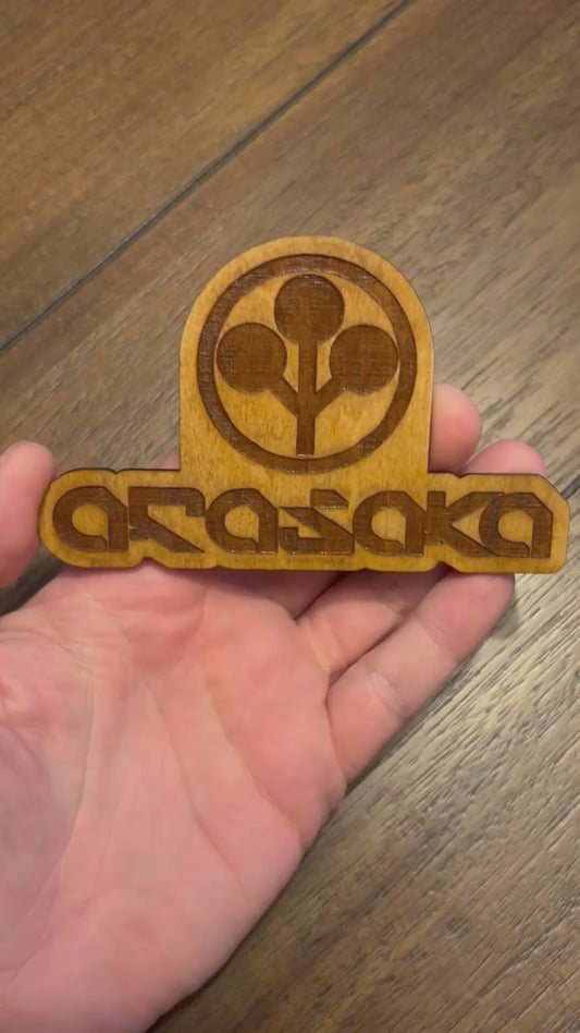 Stained basswood fridge magnet of the Arasaka logo from the Cyberpunk 2077 video game
